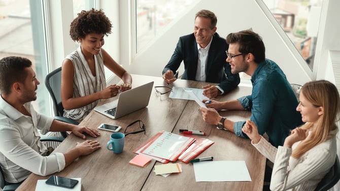 group of employees having casual meeting