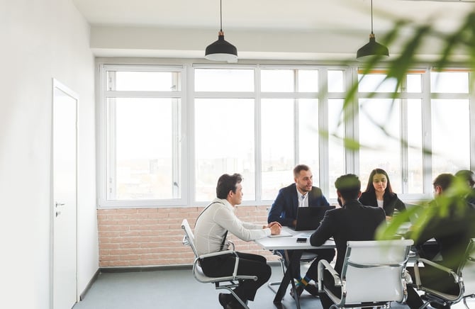 group of young business people having a meeting