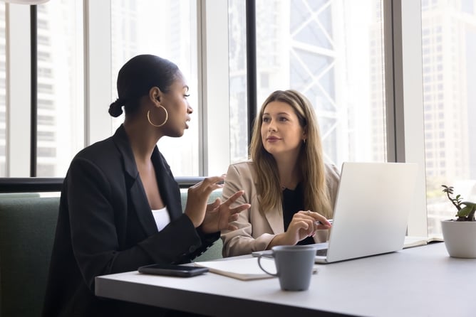 coworkers having meeting in modern office